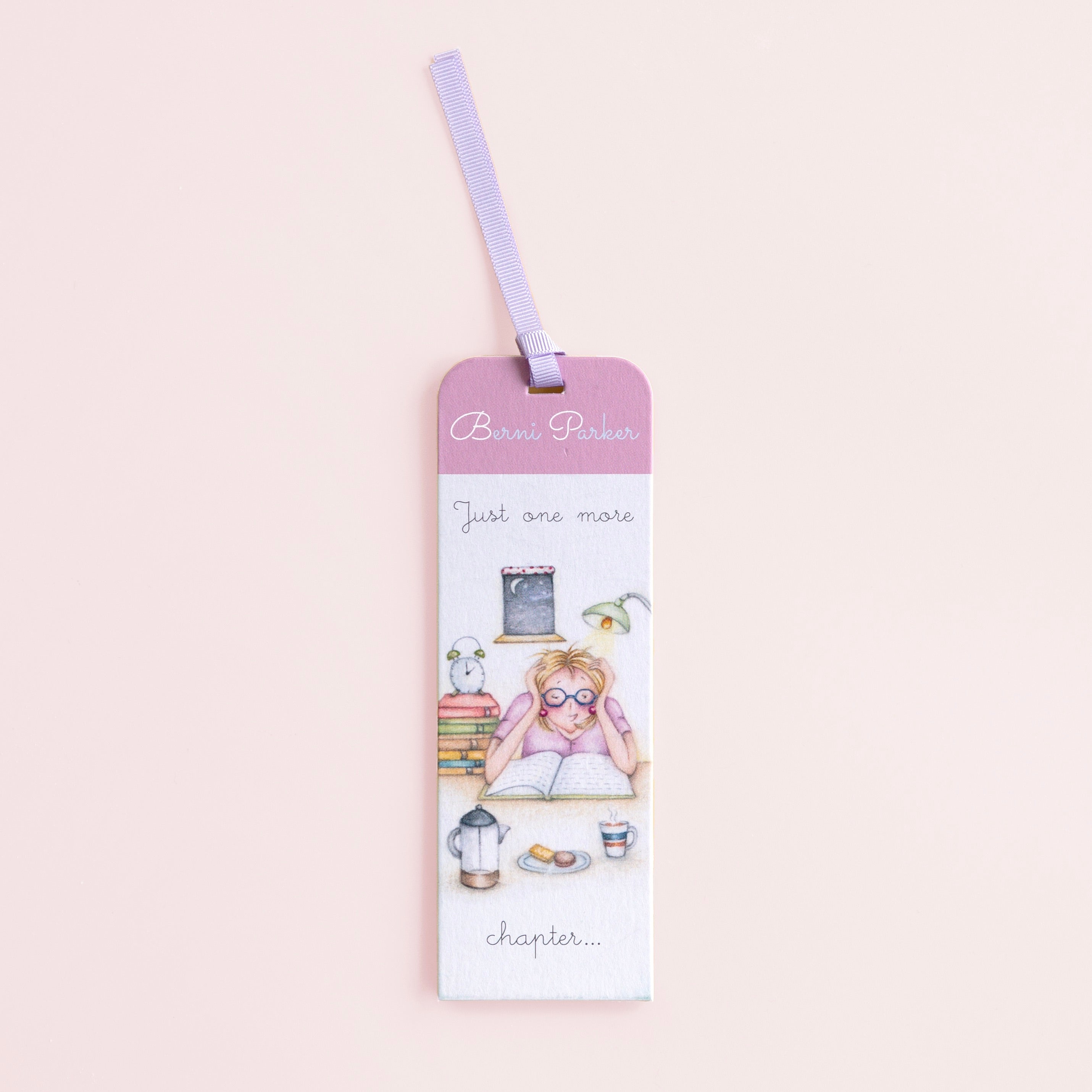 A bookmark with an illustration of a character reading a book, titled 'Just one more chapter', with a decorative ribbon at the top.