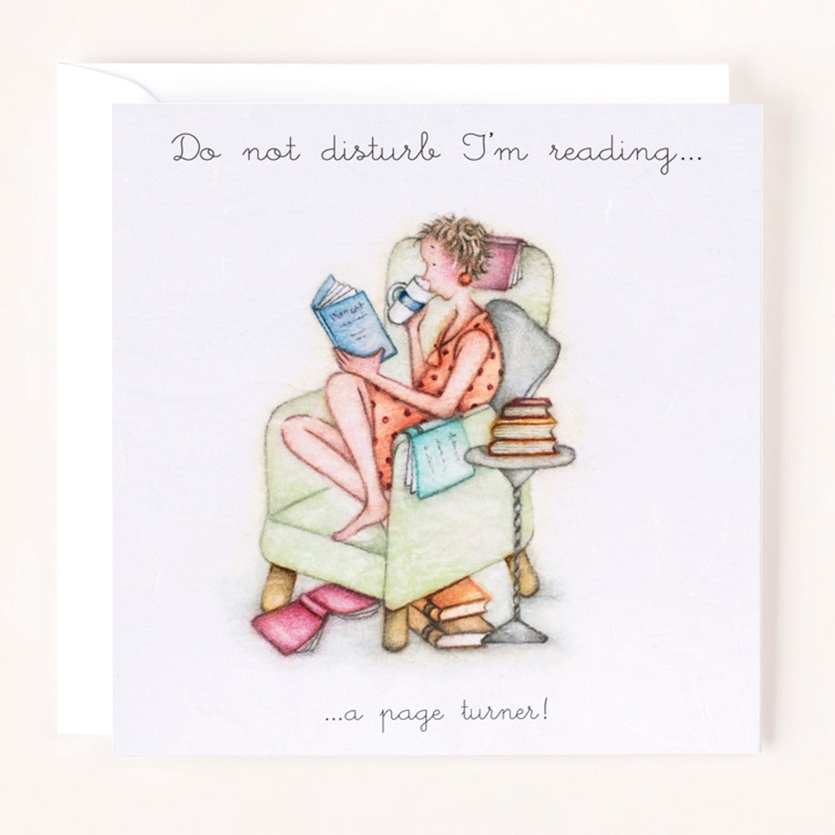 Greeting card with an illustration of a women reading a book, accompanied by the text 'Do not disturb I'm reading a page turner!'.