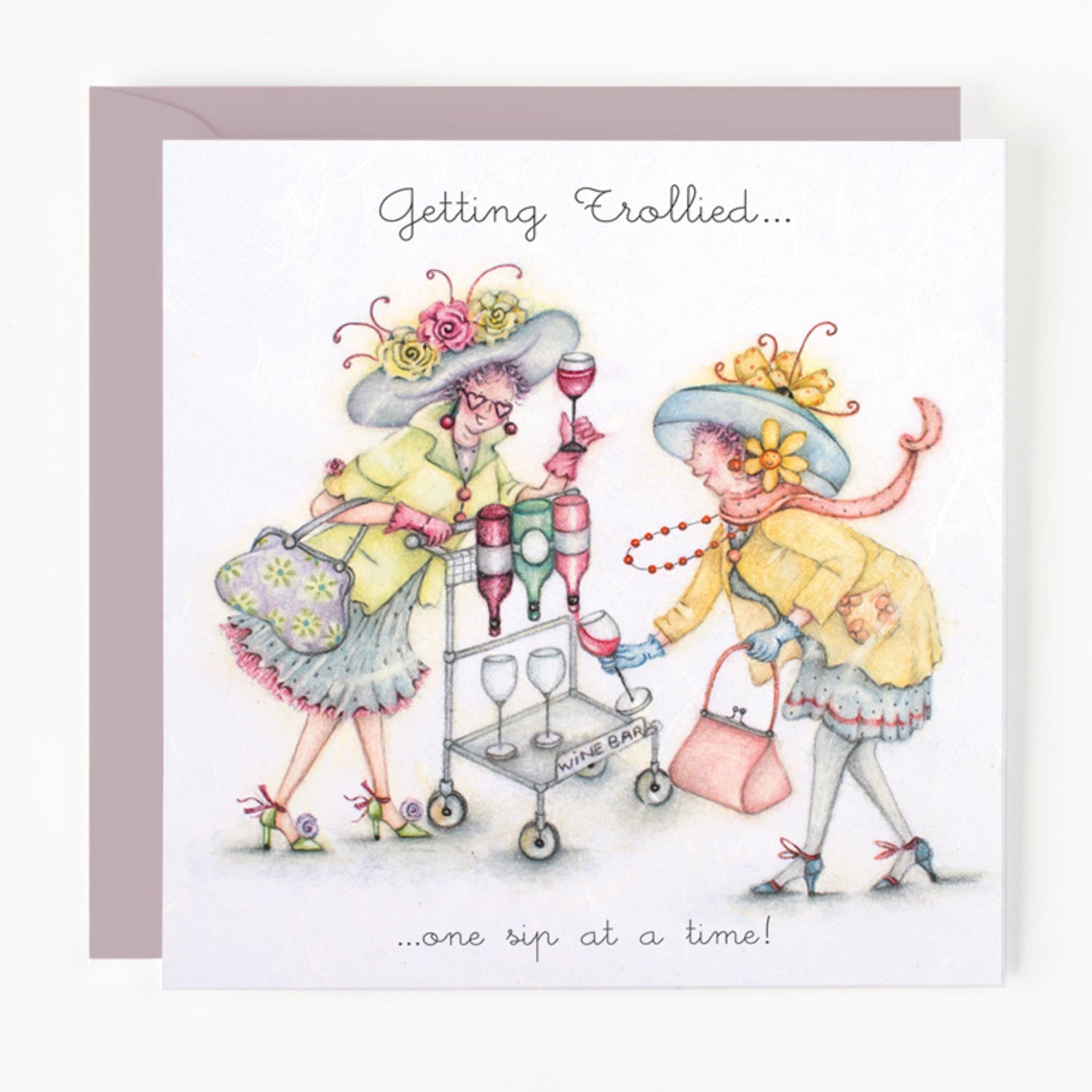 Card with illustration of two women in hats pushing a drinks trolley, with text 'Getting Trolled... one sip at a time!'
