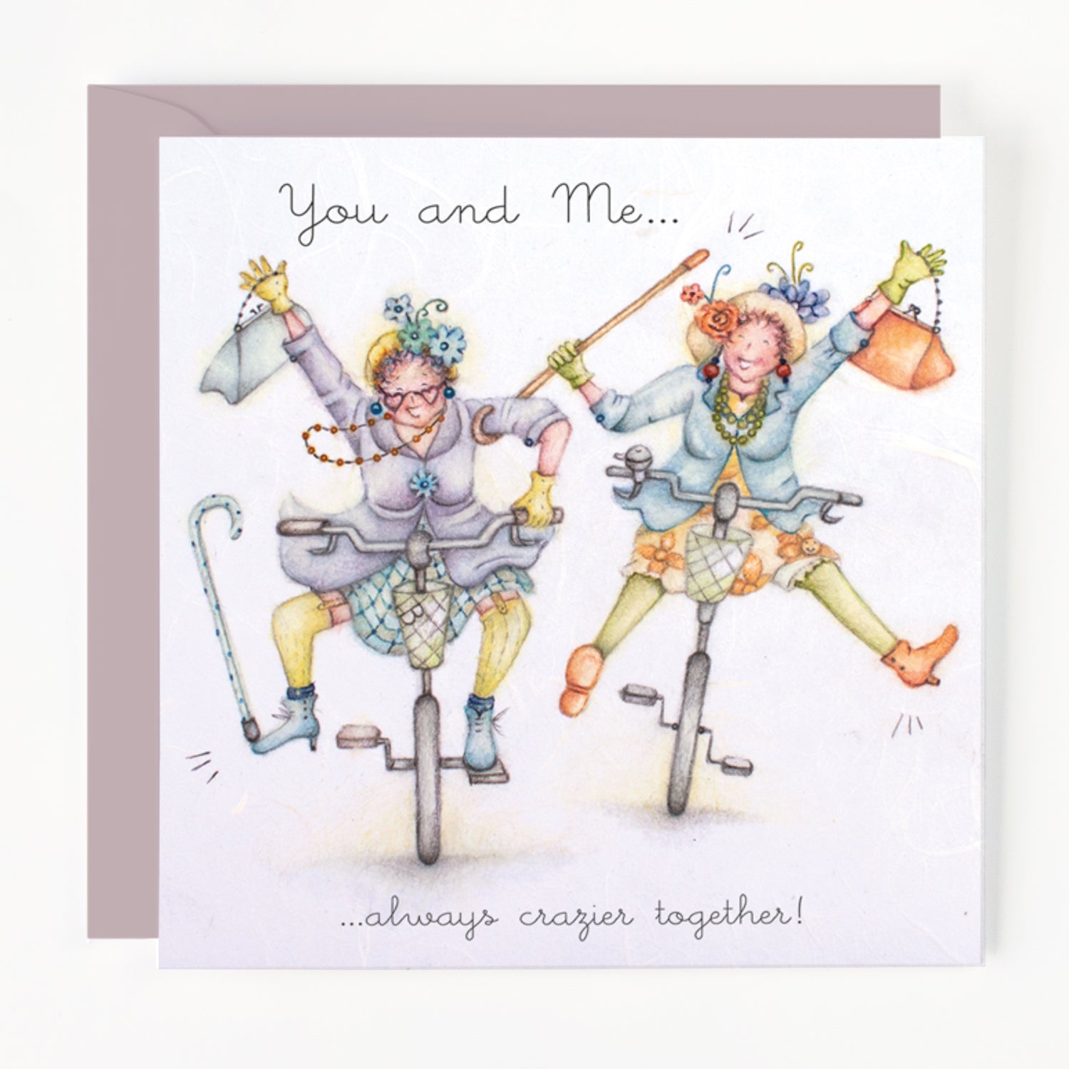 Card with two mature ladies riding unicycles with text 'You and Me... always crazier together!'